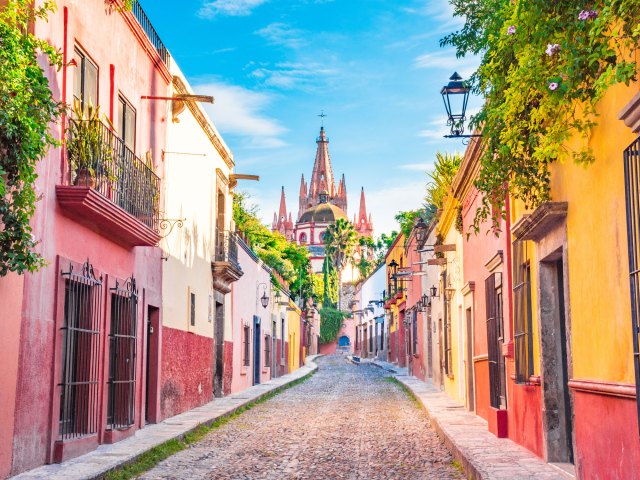 Narrow street lined with colorful homes in Guanajuato, Mexico