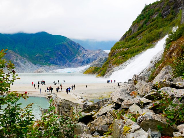 People viewing Mendenhall Glacier in Alaska