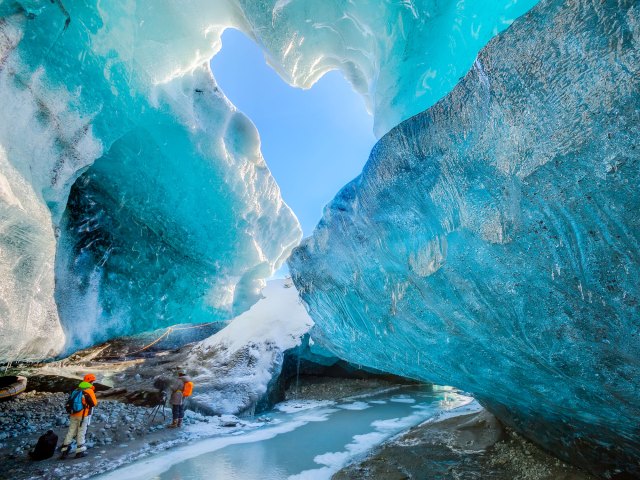 People exploring Mendenhall Ice Caves in Alaska