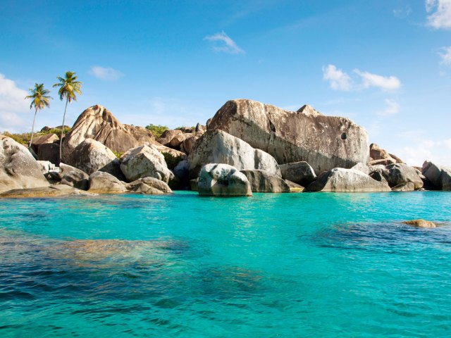 Beach boulders and translucent waters of Virgin Gorda in the British Virgin Islands