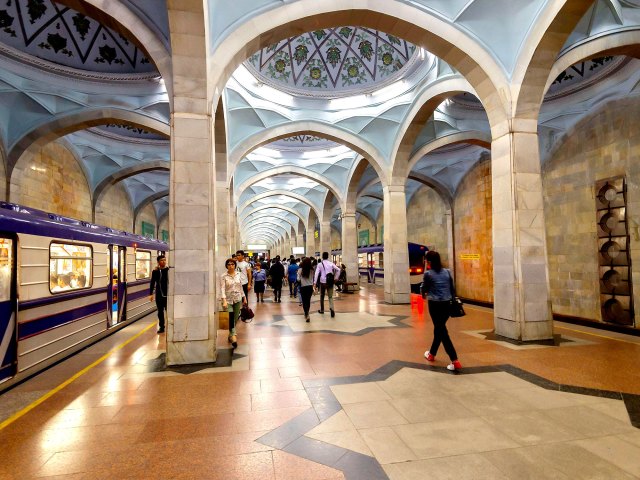 Commuters inside the Alisher Navoiy Station in Tashkent, Uzbekistan