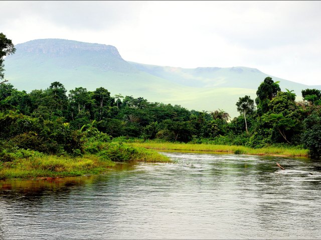 Waters of the Congo River in Central Africa with mountains in distance