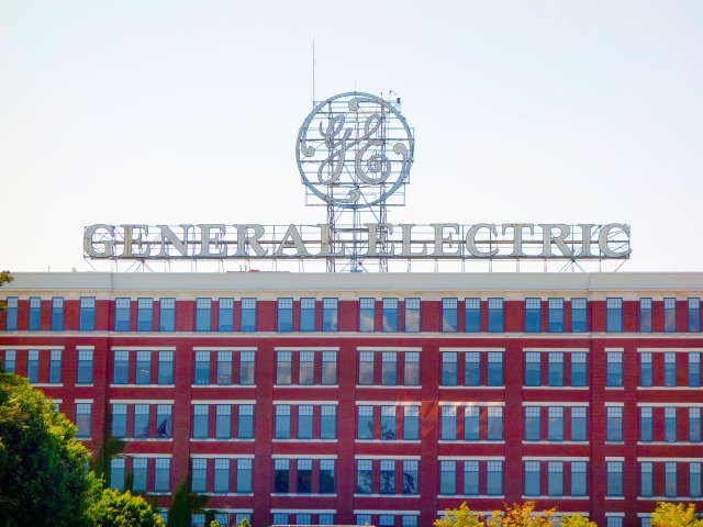 Logo and sign for General Electric atop building in Schenectady, New York