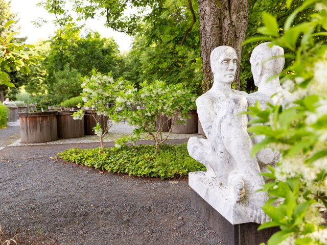 Statue and gardens at  Botanischer Garten der Universität Leipzig in Germany