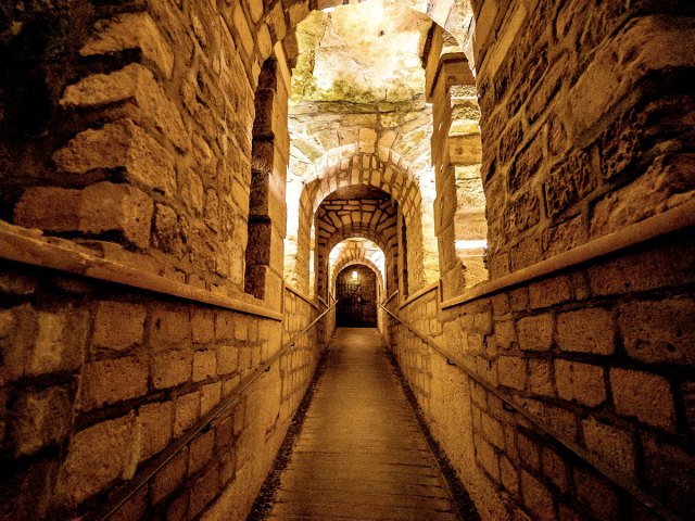 Underground walkway inside Catacombs of Paris