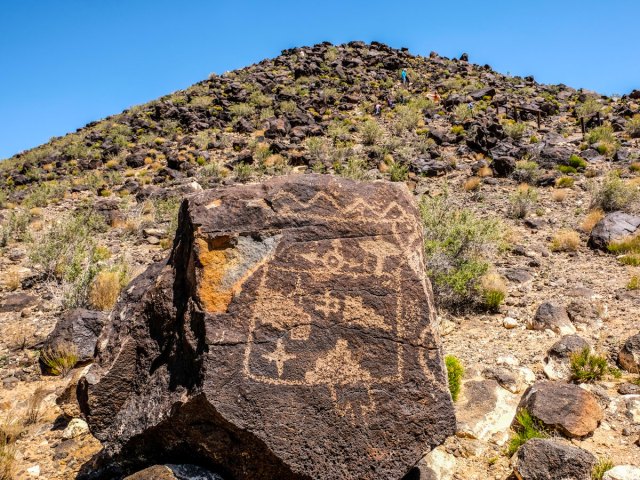 Petroglyph carved into rock in desert in New Mexico's Petroglyph National Monument