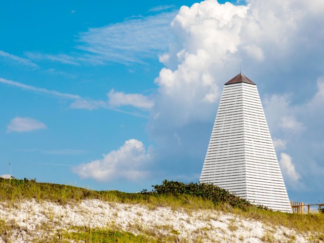 Tall white structure on sandy beach in Seaside, Florida