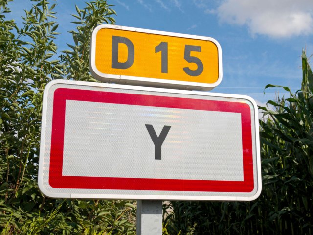 Close-up of road sign indicating Y, France