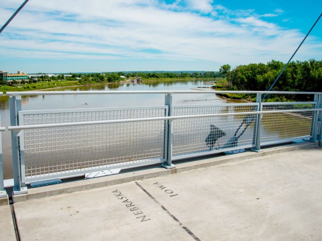 Nebraska-Iowa border marked on a bridge over the Missouri River