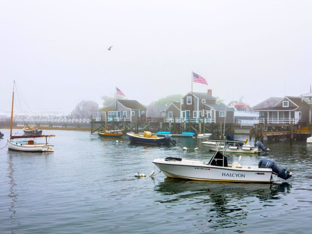 Boats in fog-shrouded harbor of Nantucket, Massachusetts