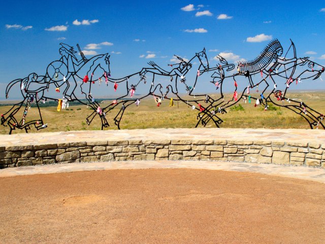 Sculptures of Indigenous warriors on horses at Indian Memorial at Little Bighorn Battlefield National Monument in Montana
