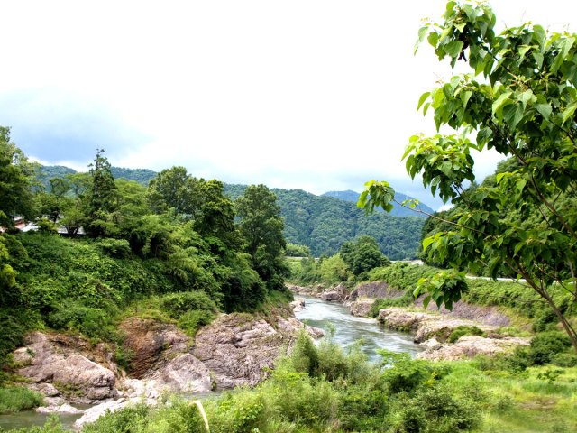 River running through lush landscape of Japan's Honshu island