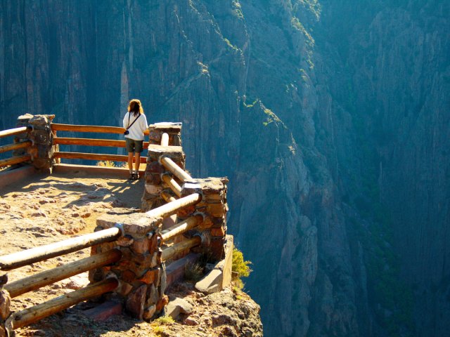 Person on overlook in Black Canyon of the Gunnison National Park in Colorado