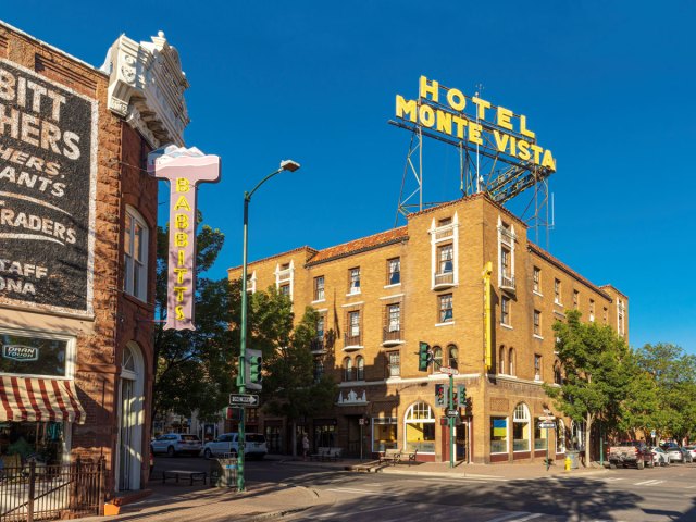 Yellow sign indicating the Hotel Monte Vista in Flagstaff, Arizona