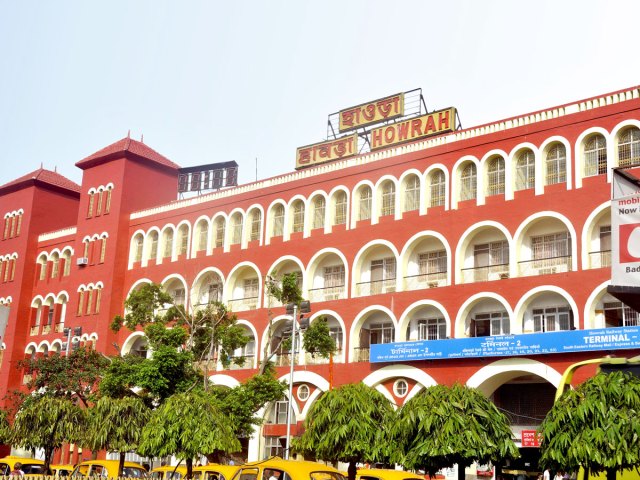 Red exterior of Howrah Junction Railway Station in India