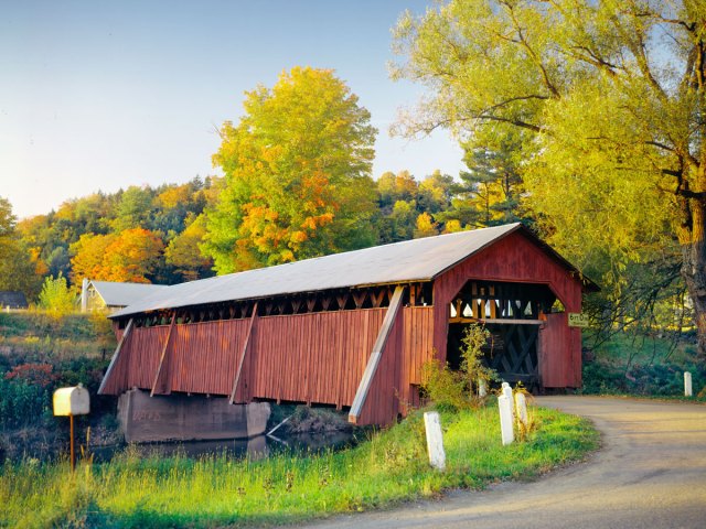 Covered bridge surrounded by autumn foliage in Delhi, New York