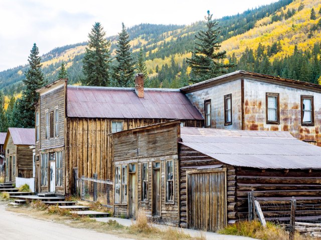 Wooden buildings surrounded by mountains in St. Elmo, Colorado