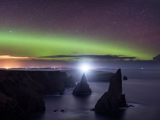 The northern lights seen over the cliffs of Caithness, Scotland