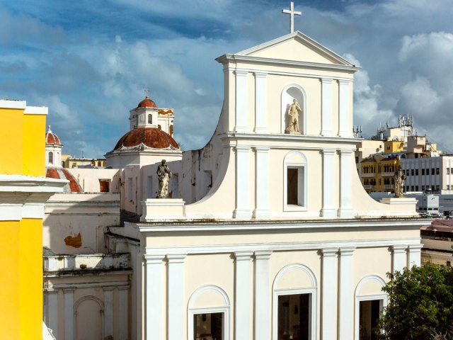 Image of the Cathedral of San Juan Bautista in Puerto Rico with San Juan in background
