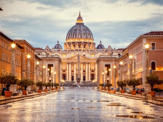 St. Peter's Square and St. Peter's Basilica in Vatican City, seen at dusk