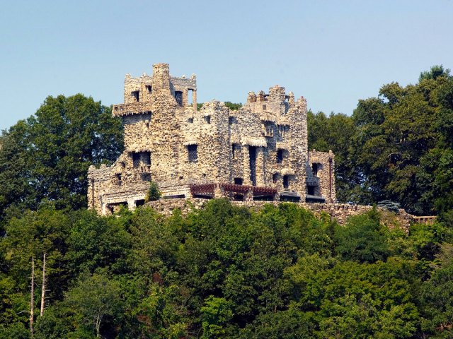 Stone ruins of Gillette Castle in Lyme, Connecticut, surrounded by trees