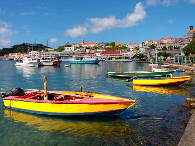 Brightly painted boats in marina in Grenada