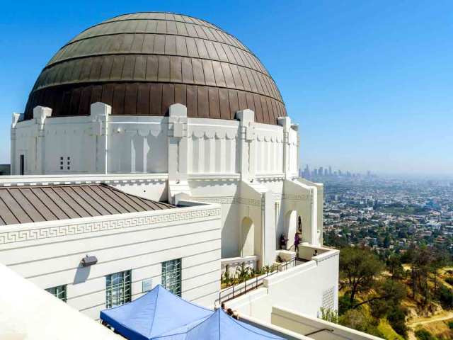 View of Griffith Observatory dome and Los Angeles skyline in the distance