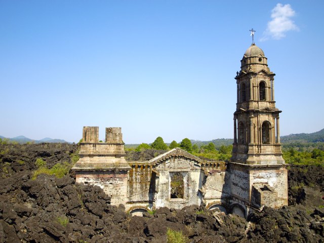 Historic church surrounded by forest near Parícutin volcano in Mexico