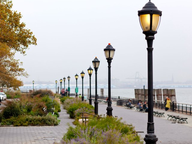 Lampposts lining walkway along Hudson River in New York, New York