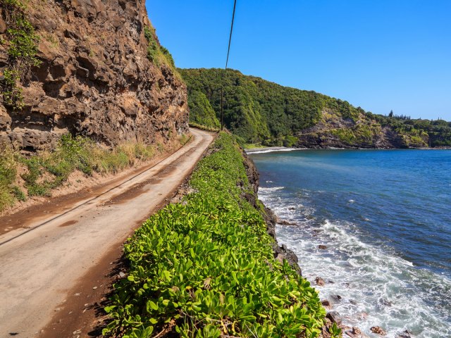 Road to Hana hugging cliffside stretch in Maui