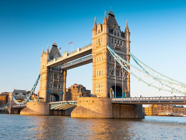 View of the Tower Bridge in London from banks of the Thames River