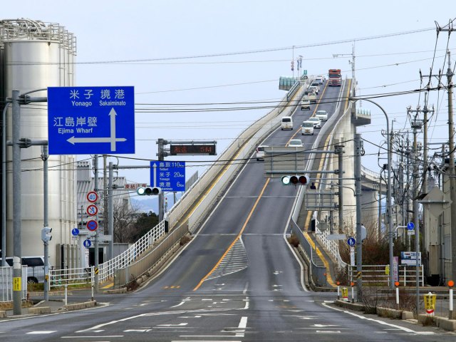 Cars driving on steep incline of the Eshima Ohashi Bridge in Japan