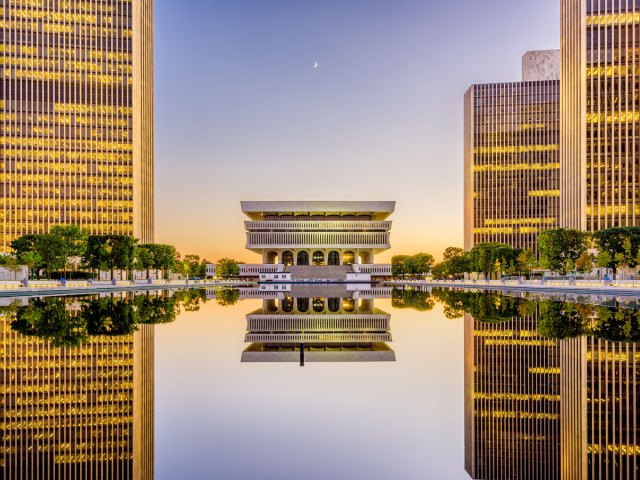Empire State Plaza reflecting onto pool in Albany, New York