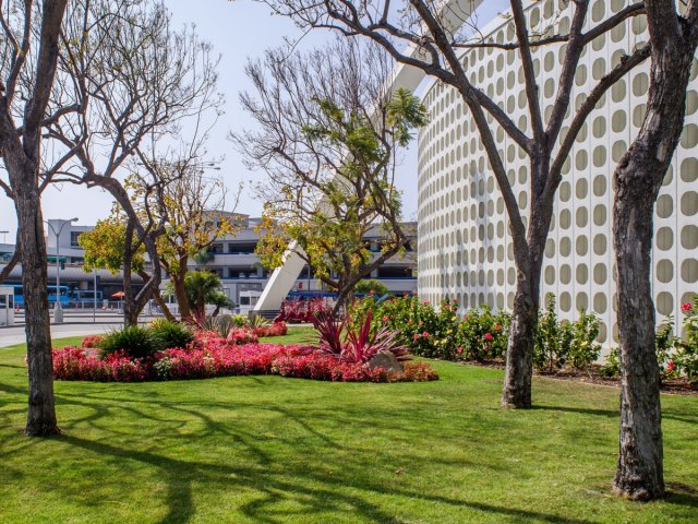 Lawn and flower garden beside Theme Building at Los Angeles International Airport