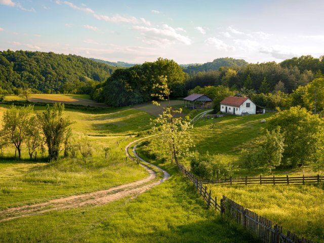Farmhouse on rolling green hills in Serbia