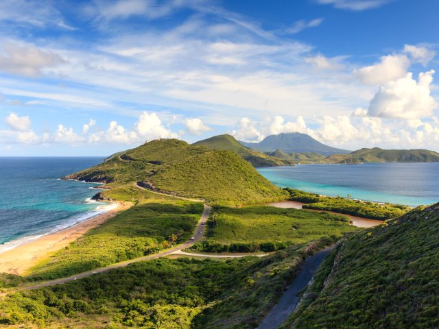 Mountainous landscape flanked by the Caribbean Sea in St. Kitts and Nevis