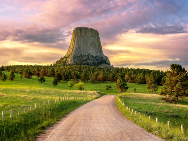 Dirt road leading to Devils Tower rock formation in Wyoming
