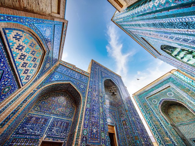 Upward view of the intricate tiles of Shah-i-Zinda Mausoleum in Samarkand, Uzbekistan