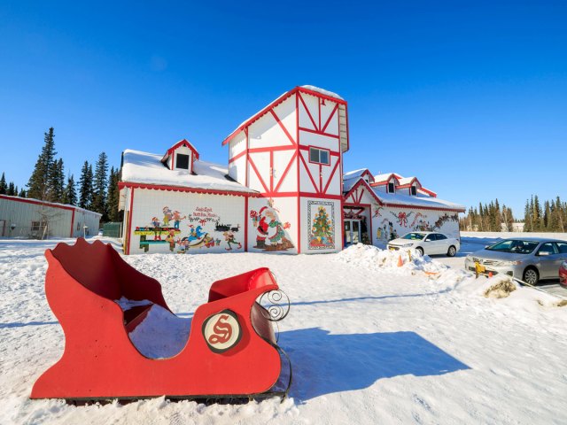 Red sled and decorated house in North Pole, Alaska