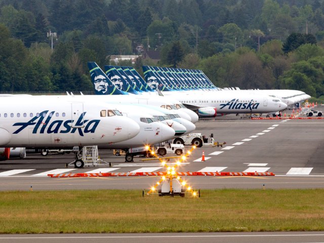Alaska Airlines airplanes lined up on runway