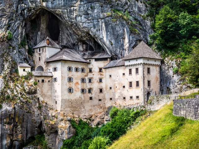 Predjama Castle built into a cave entrance in Slovenia