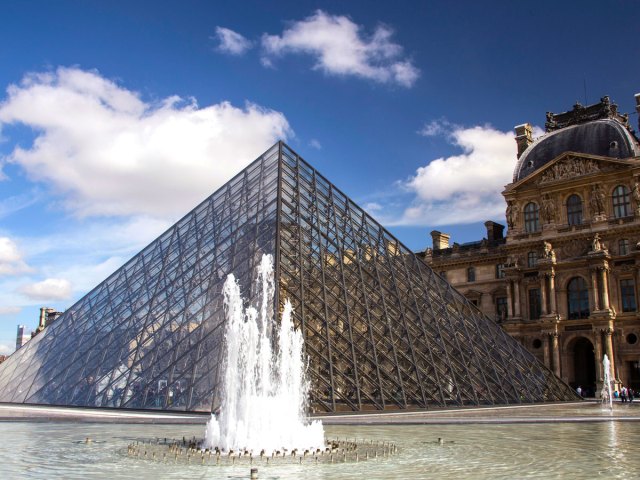 Glass pyramid and fountain the Louvre museum in Paris, France