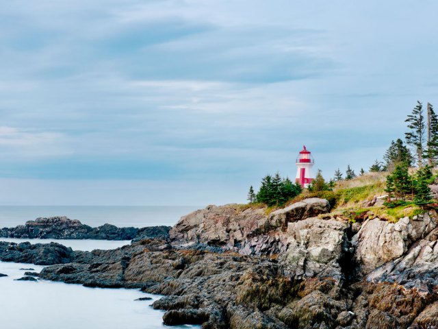 Lighthouse along the rocky coast of New Brunswick, Canada