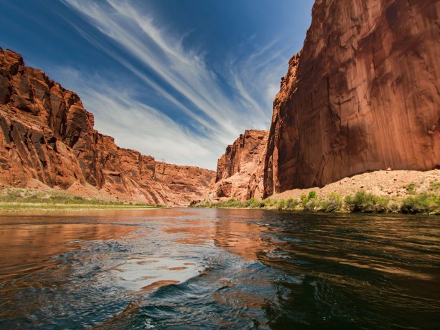 Colorado River flanked by steep sandstone canyon walls