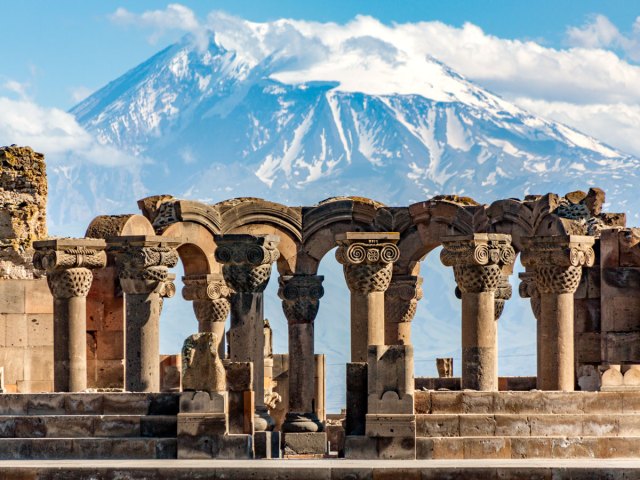 Ruins of the Zvartnos Temple in Yerevan, Armenia, with Mount Ararat in the background