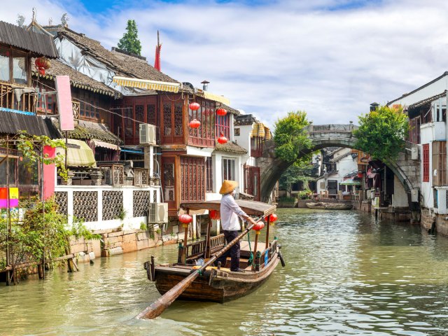 Traditional longboat on canal in Shanghai, China