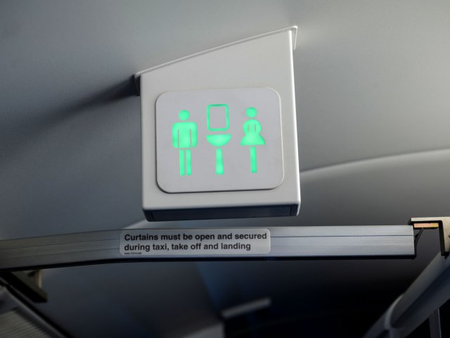 Lavatory sign in airplane