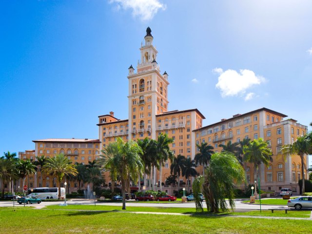 Palm trees and lawn facing the Miami Biltmore Hotel in Coral Gables, Florida