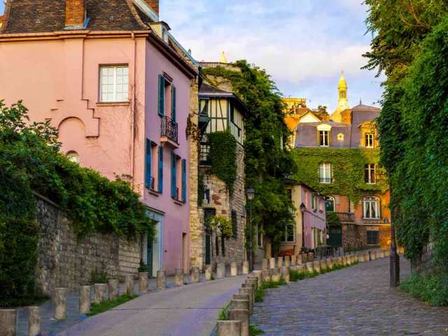 Winding cobblestone street in the Montmartre district of Paris, France