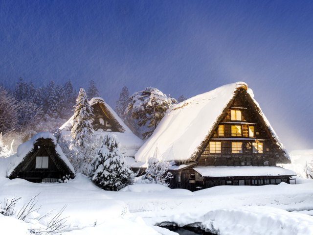 Snow-covered traditional thatched-roof homes of Shirakawa, Japan